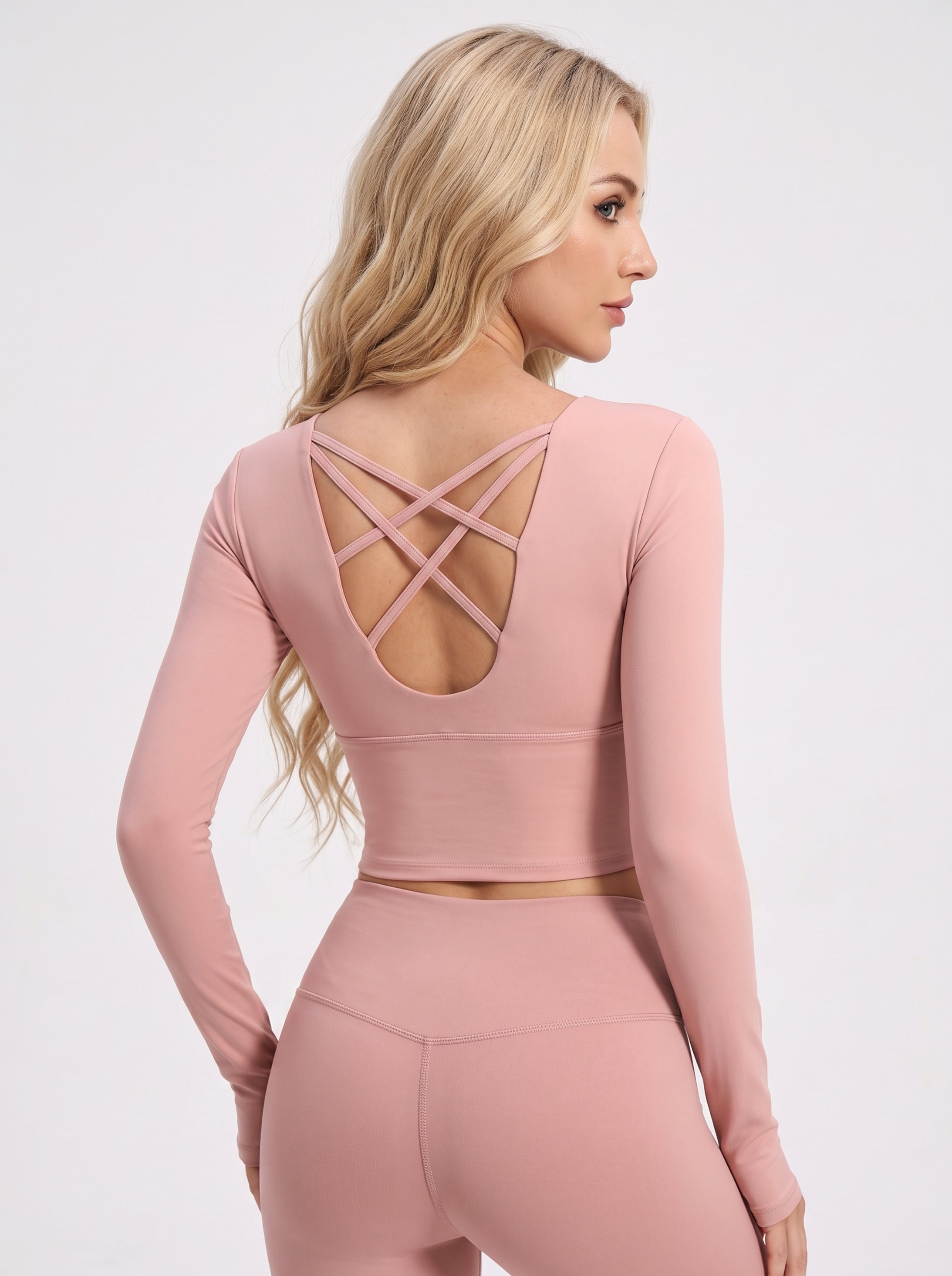 VLIZ peach pink long-sleeve sports bra showing cross-back construction, back view