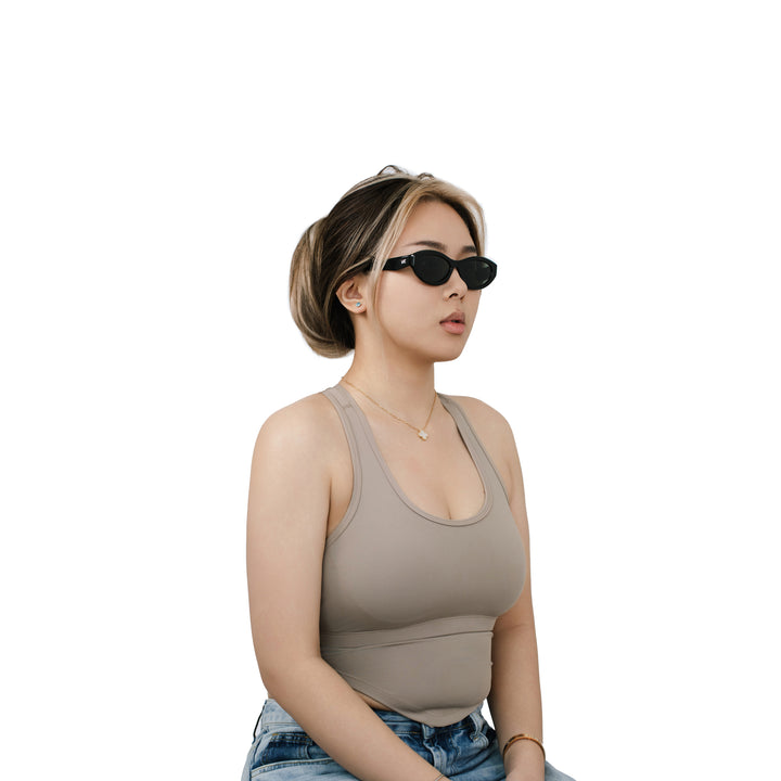 VLIZ Nolita oval sunglasses with black frame and black lenses, featuring smooth oval design and engraved logo on temples.