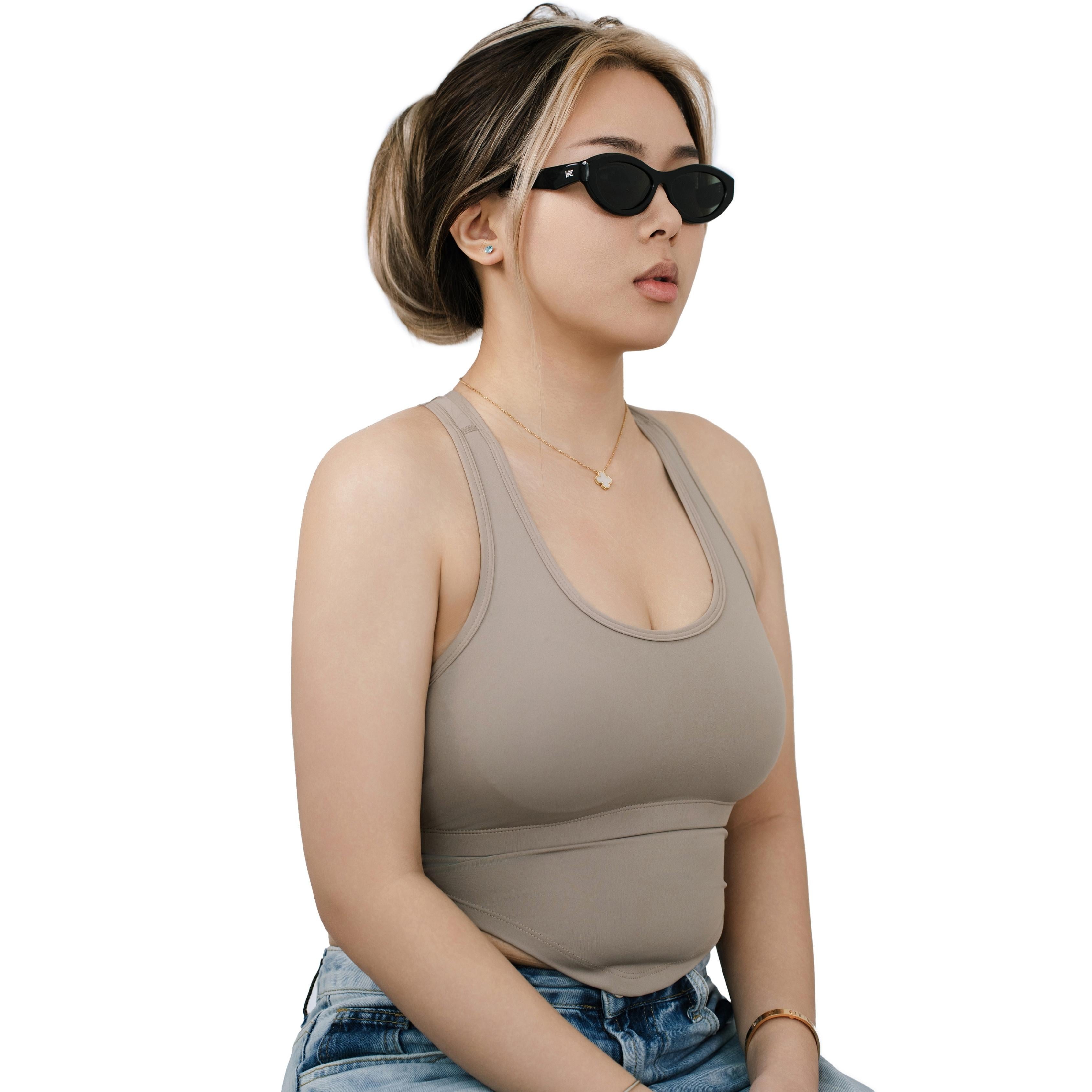 VLIZ Nolita oval sunglasses with black frame and black lenses, featuring smooth oval design and engraved logo on temples.