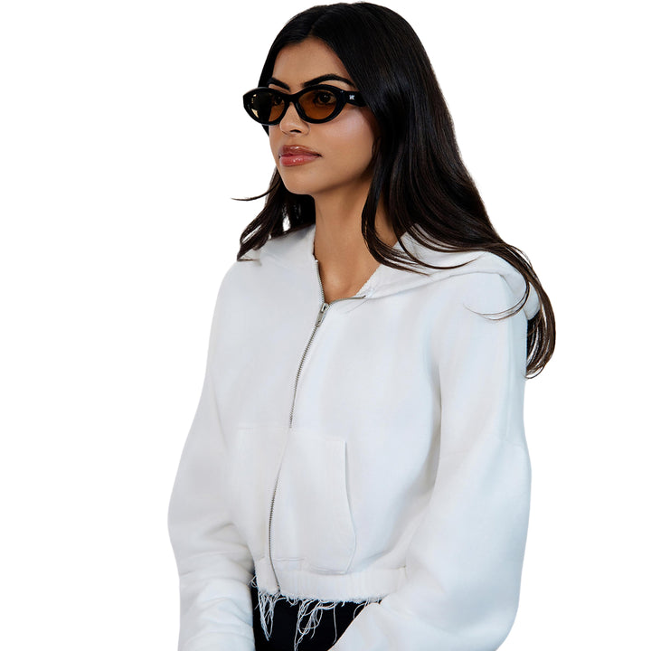 VLIZ Nolita oval sunglasses with black frame and brown lenses, featuring smooth oval design and engraved logo on temples.