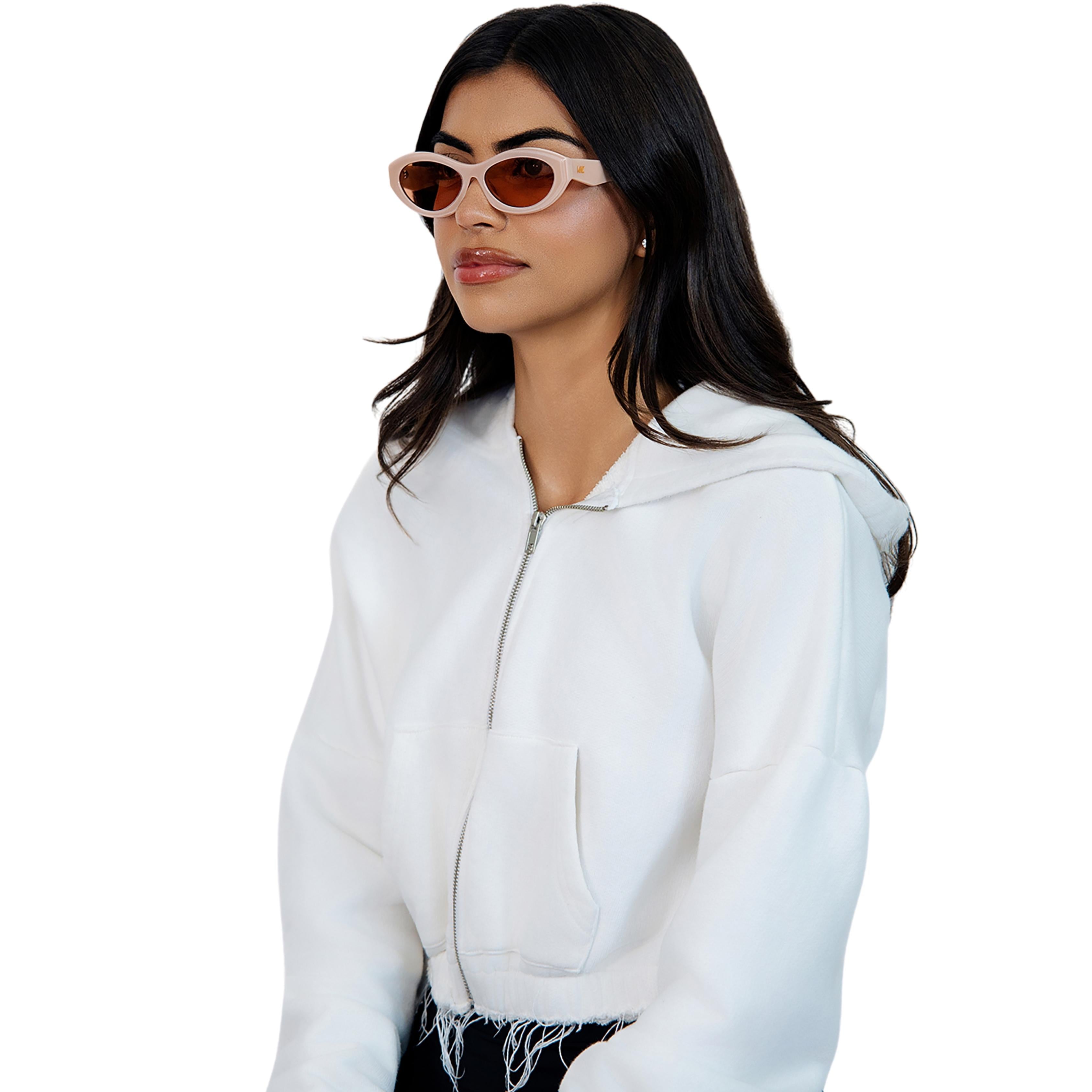 VLIZ Nolita oval sunglasses with pink frame and pink lenses, featuring smooth oval design and engraved logo on temples.