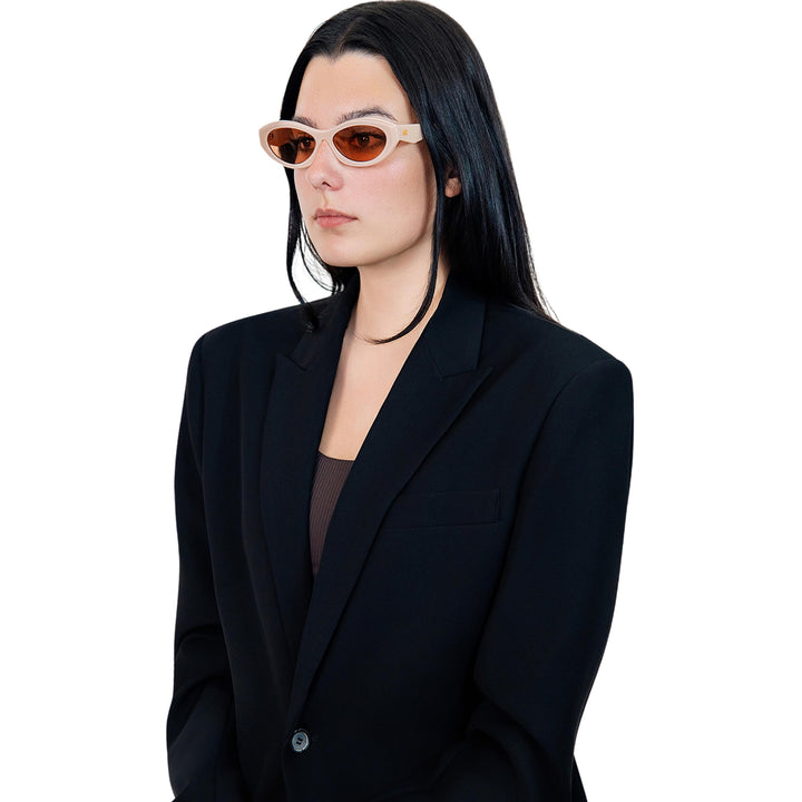 VLIZ Nolita oval sunglasses with pink frame and pink lenses, featuring smooth oval design and engraved logo on temples.