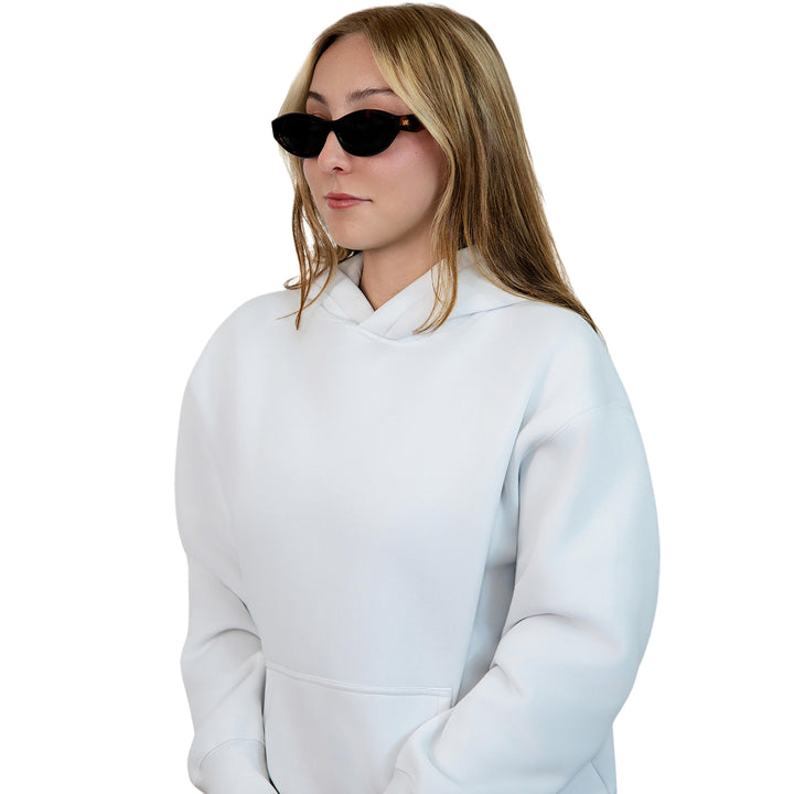VLIZ Nolita oval sunglasses with tortoise frame and black lenses, featuring smooth oval design and engraved logo on temples.