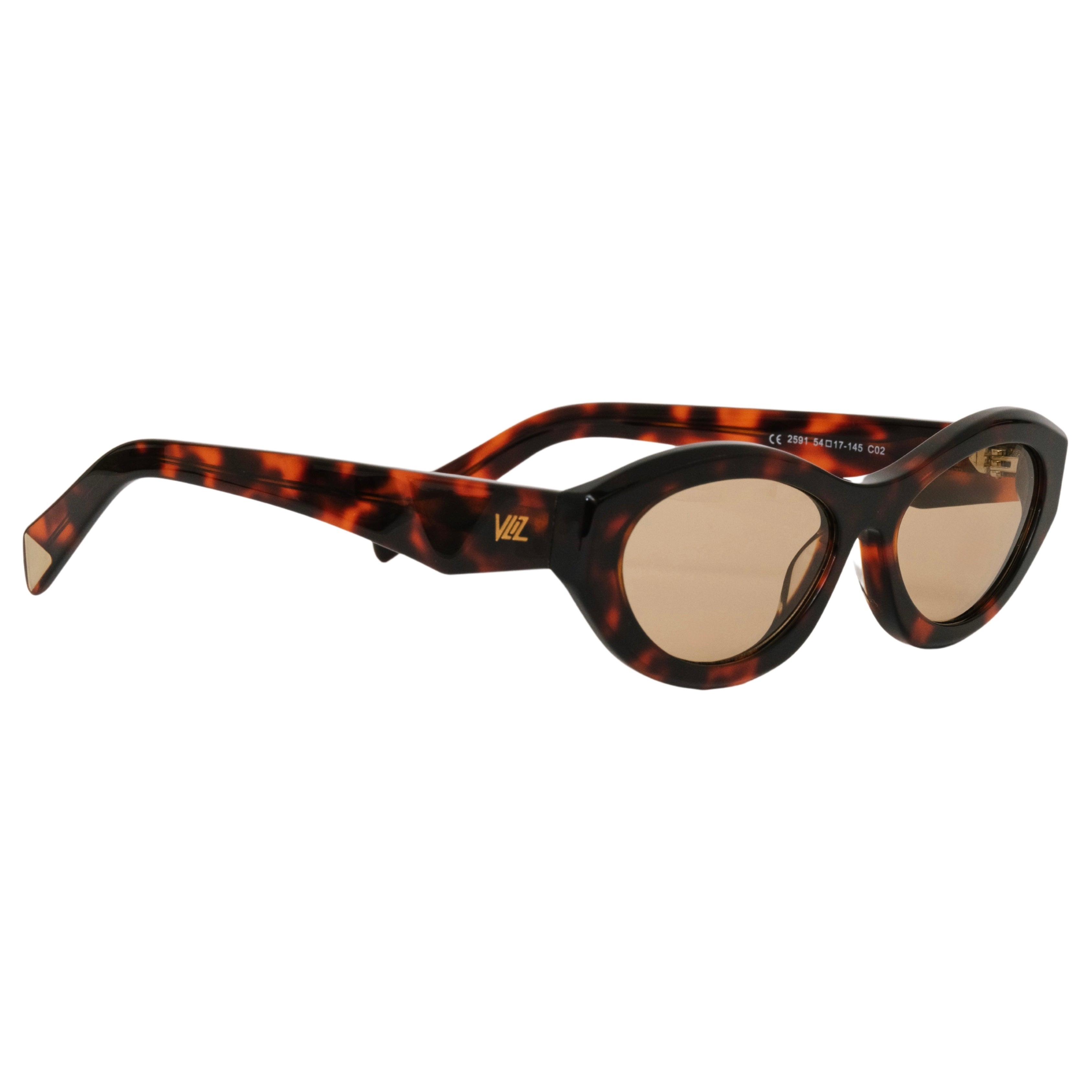 VLIZ Nolita oval sunglasses with tortoise frame and brown lenses, featuring smooth oval design and engraved logo on temples.