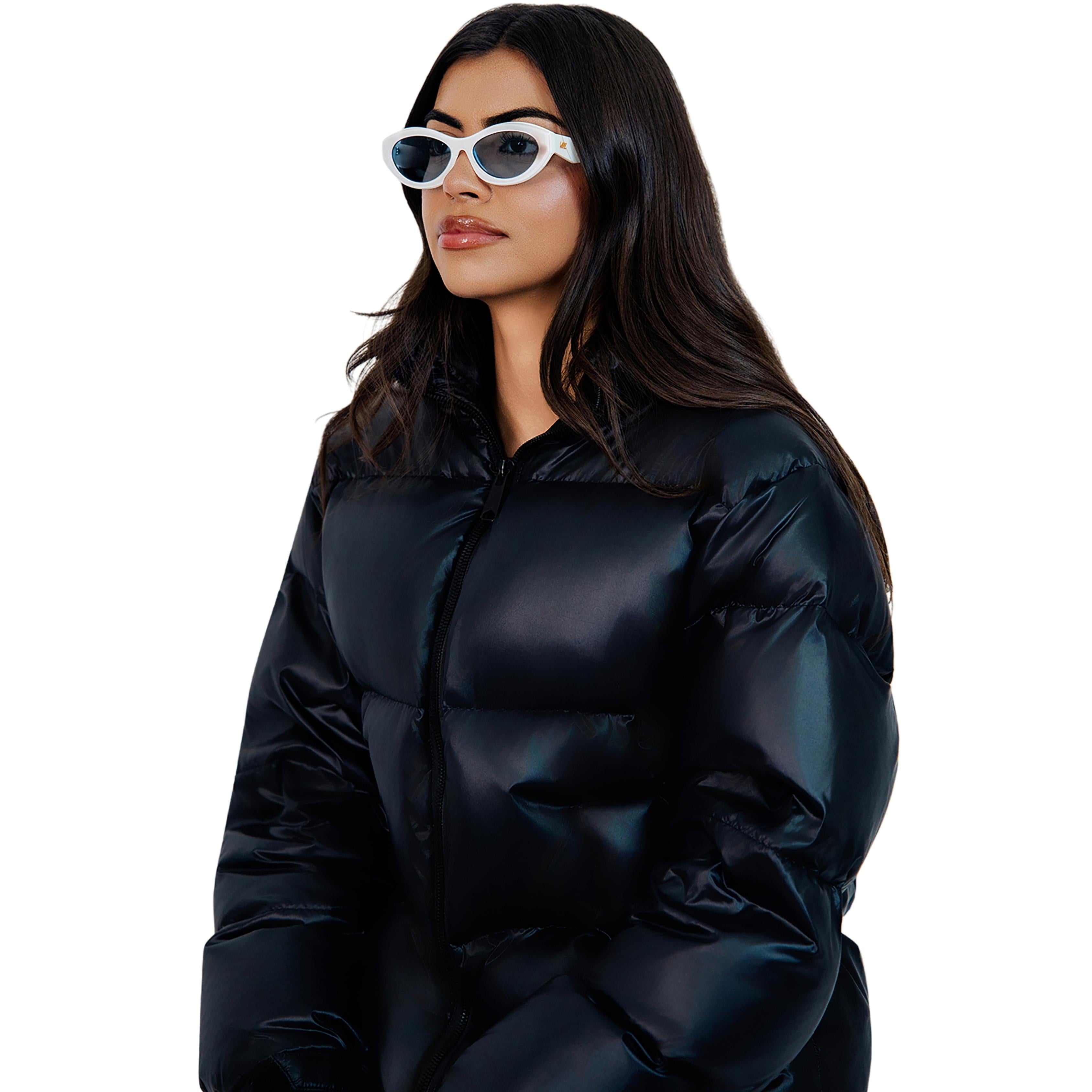 VLIZ Nolita oval sunglasses with white frame and blue lenses, featuring smooth oval design and engraved logo on temples.