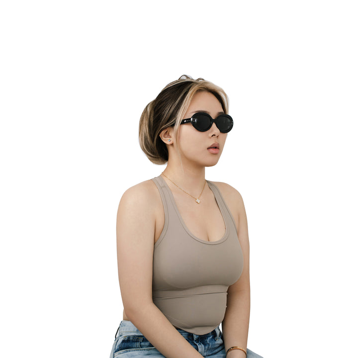 VLIZ Oracle sunglasses with a black wide oval frame, black lenses, retro styling, and engraved logo on temples.