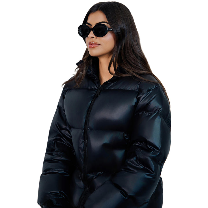 VLIZ Oracle sunglasses with a black wide oval frame, black lenses, retro styling, and engraved logo on temples.