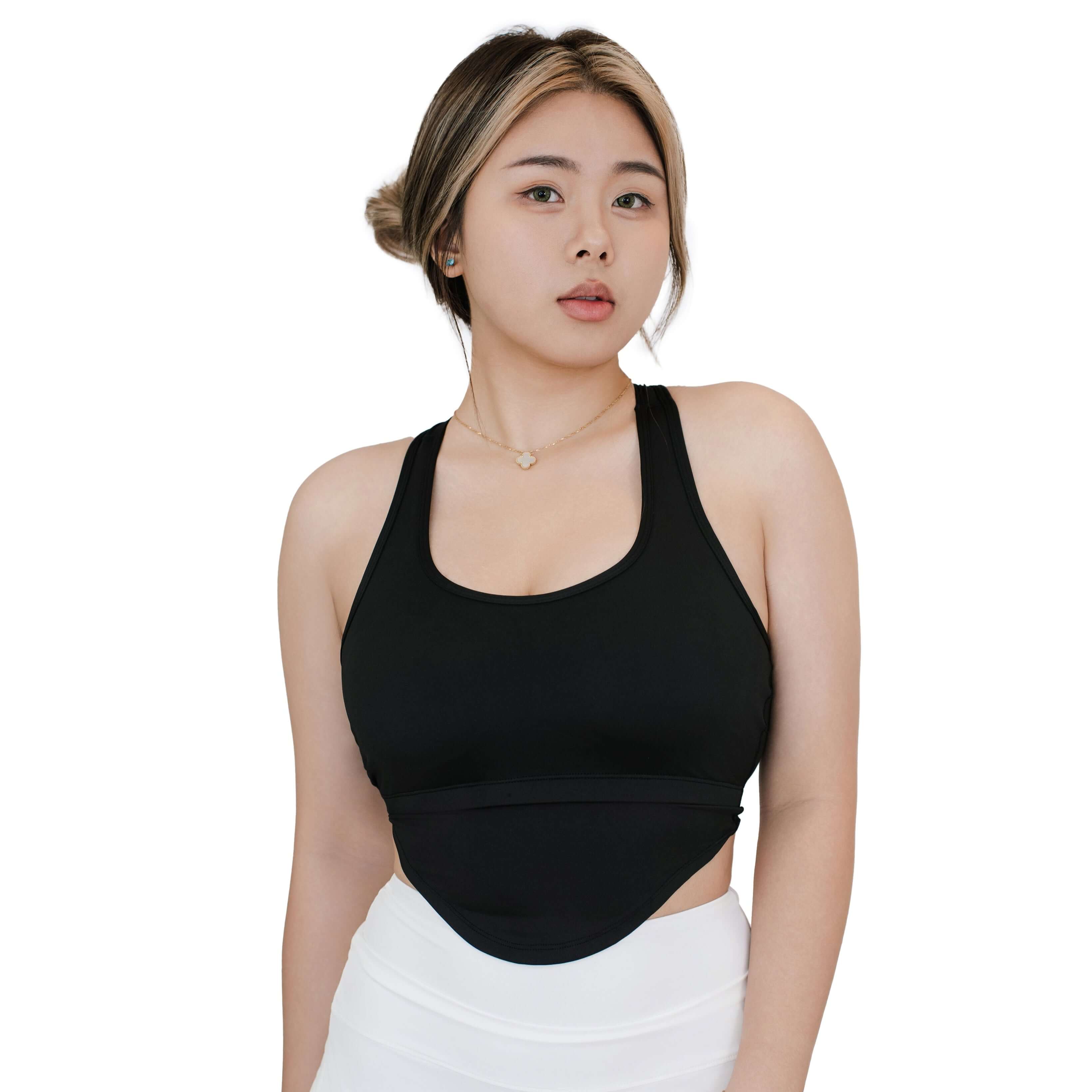 Front view of VLIZ SculptFit Racerback Sports Bra in black, featuring a wide scoop neckline, sculpting fit, and smooth compression fabric.

