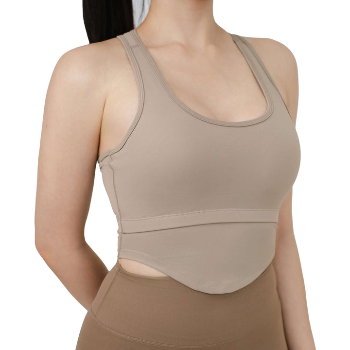 Front close-up of VLIZ SculptFit Racerback Sports Bra in khaki, showing neckline curve, seam structure, and underbust cutout design.