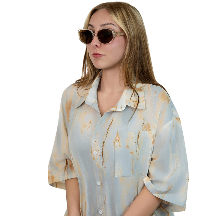 VLIZ Solace sunglasses with a brown square acetate-style frame and brown lenses, featuring sculpted edges, UV400 protection, and engraved logo on temples.