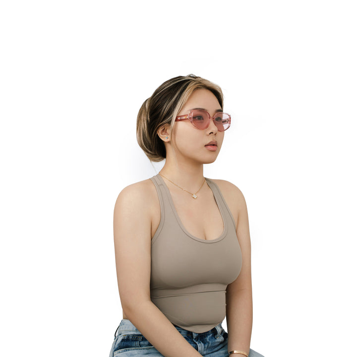 VLIZ Solace sunglasses with a pink square acetate-style frame and pink lenses, featuring sculpted edges, UV400 protection, and engraved logo on temples.
