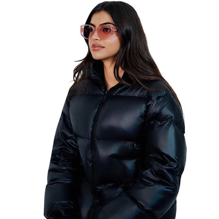 VLIZ Solace sunglasses with a pink square acetate-style frame and pink lenses, featuring sculpted edges, UV400 protection, and engraved logo on temples.
