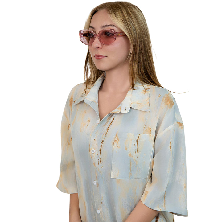 VLIZ Solace sunglasses with a pink square acetate-style frame and pink lenses, featuring sculpted edges, UV400 protection, and engraved logo on temples.
