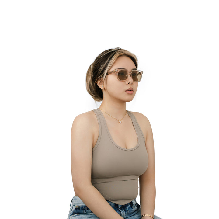 VLIZ Strata sunglasses with a translucent or tortoise square-edge frame and brown lenses, featuring a sculpted urban design, UV400 protection,and engraved logo on temples.

