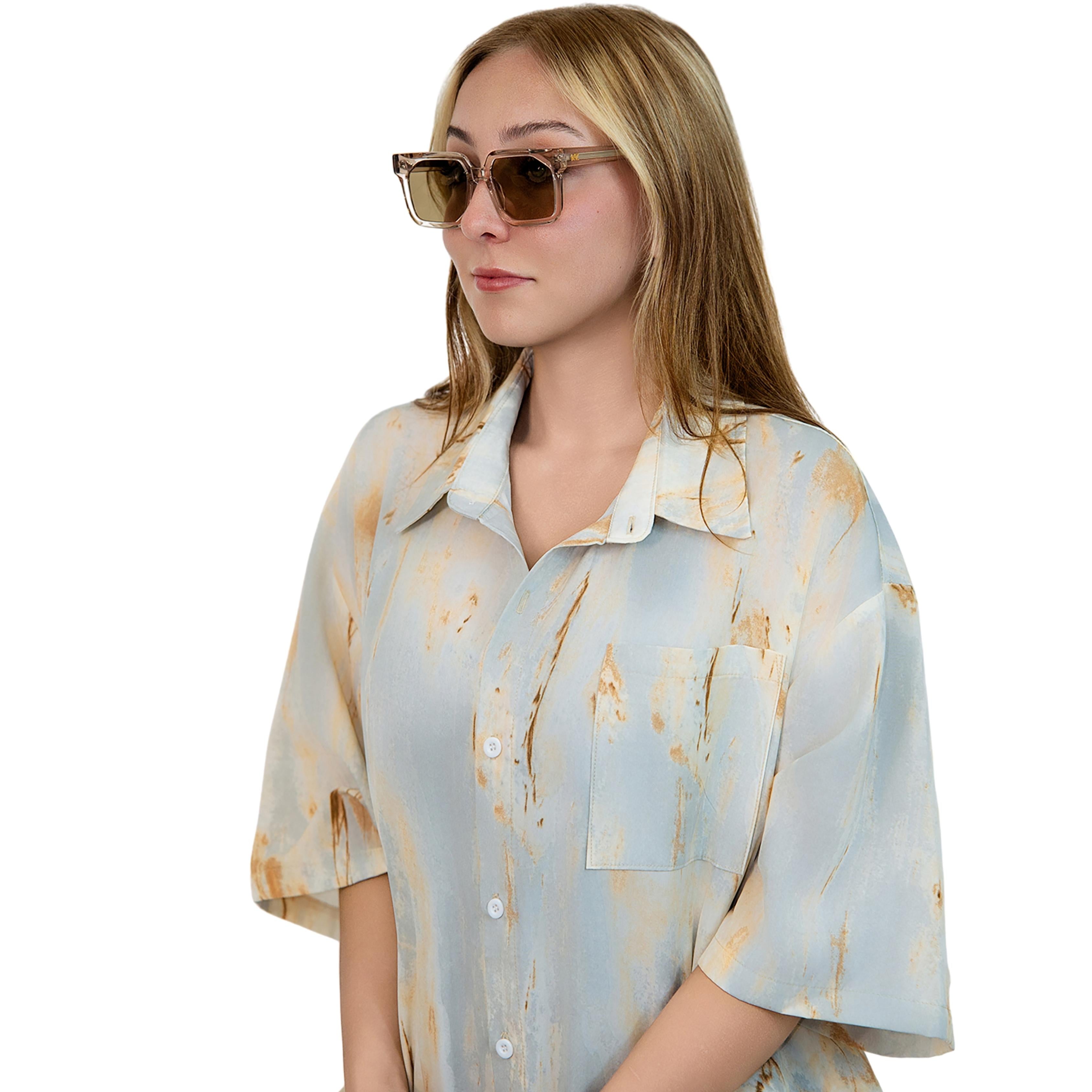 VLIZ Strata sunglasses with a translucent or tortoise square-edge frame and brown lenses, featuring a sculpted urban design, UV400 protection,and engraved logo on temples.