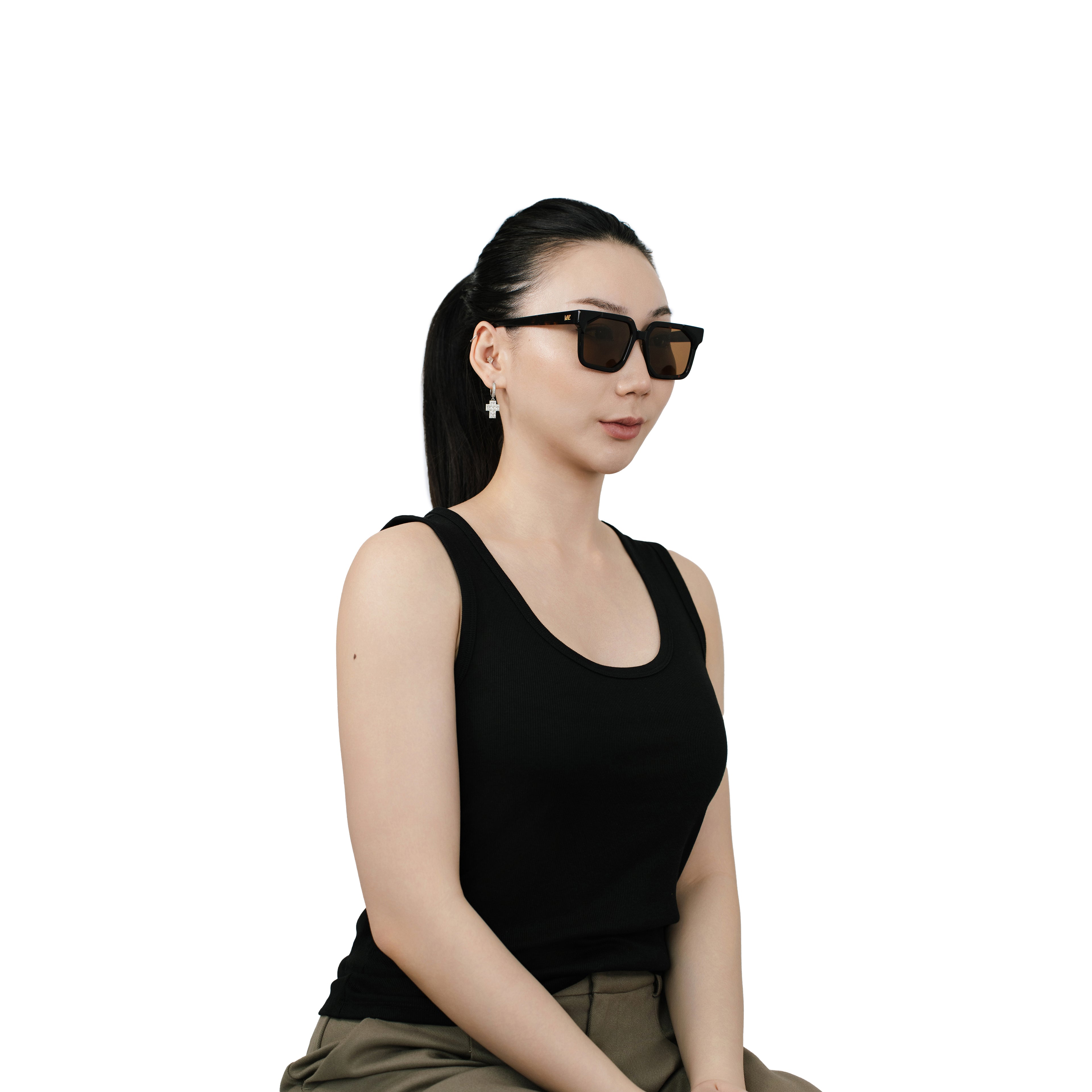 VLIZ Strata sunglasses with a translucent or tortoise square-edge frame and brown lenses, featuring a sculpted urban design, UV400 protection,and engraved logo on temples.