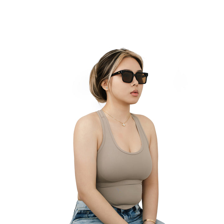 VLIZ Strata sunglasses with a translucent or tortoise square-edge frame and brown lenses, featuring a sculpted urban design, UV400 protection,and engraved logo on temples.