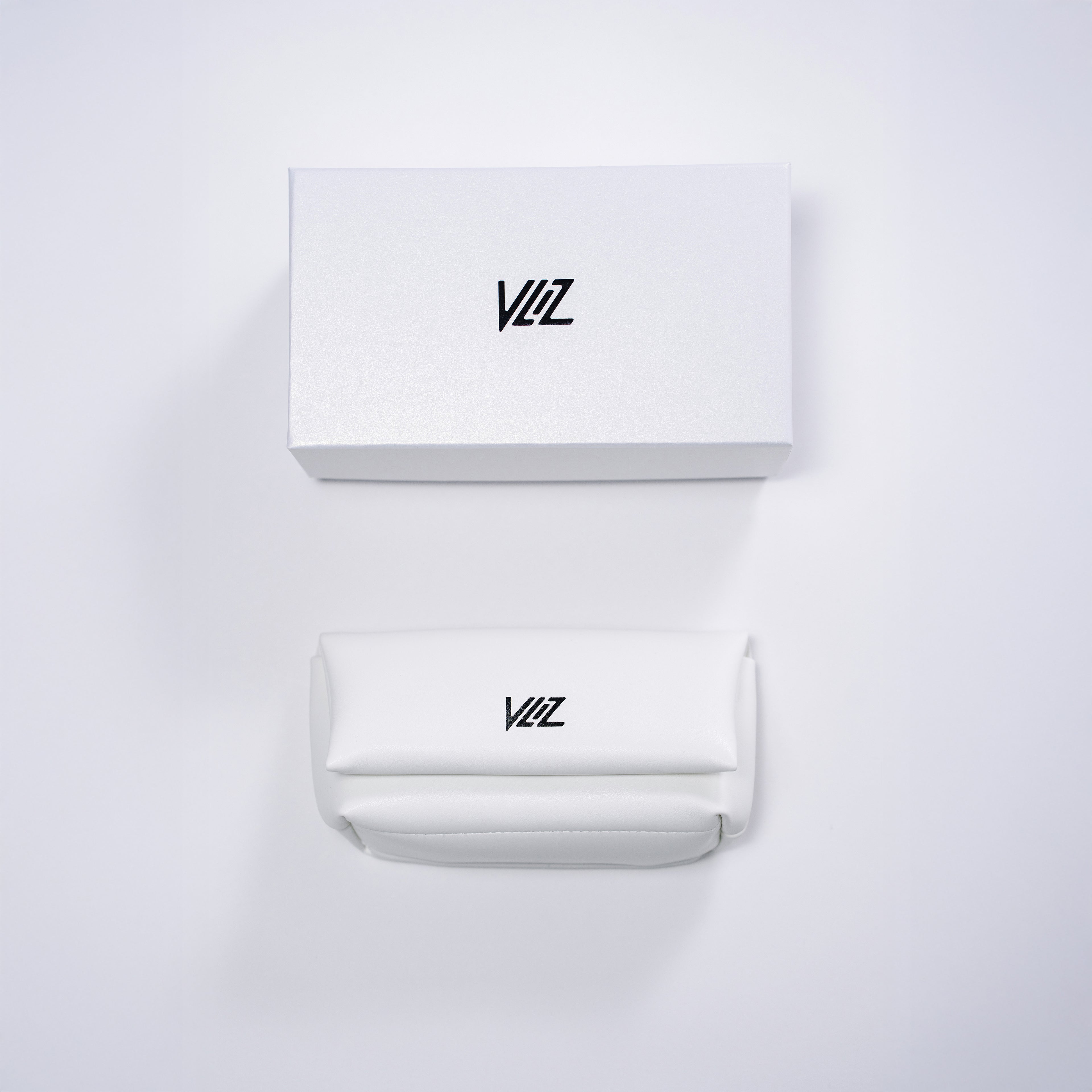 VLIZ sunglasses packaging with pearl-finish white box and folded white leather-style case, featuring black logo on both.