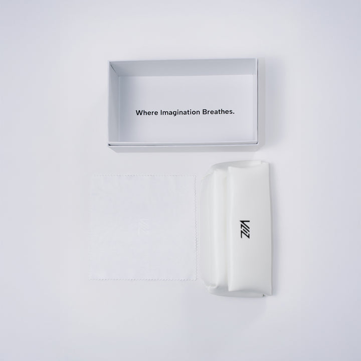 VLIZ sunglasses packaging opened to show pearl box with inner message "Where Imagination Breathes.", soft white leather case, and matching cleaning cloth