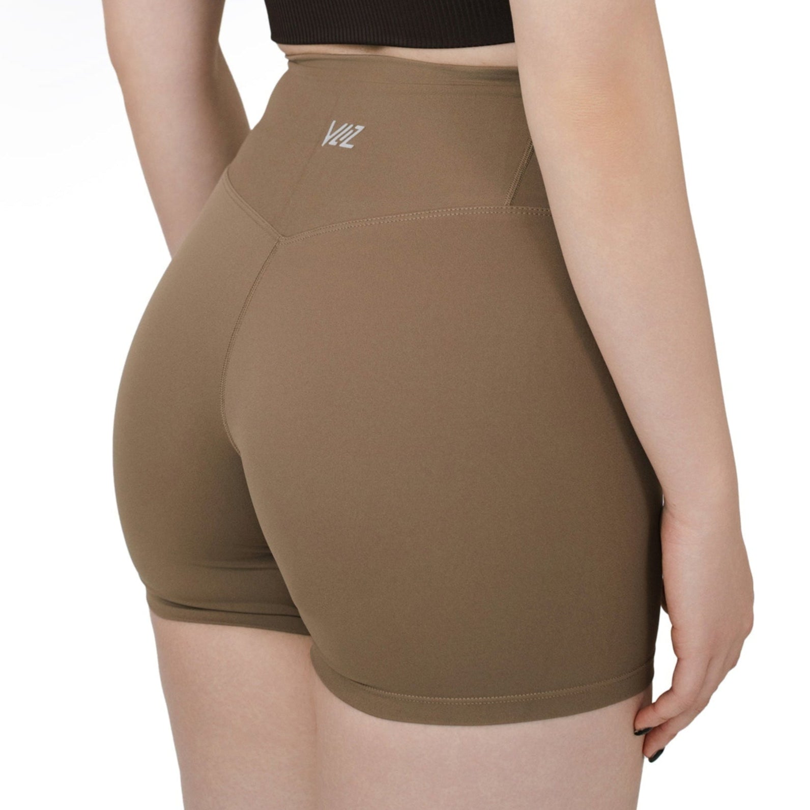 Back view of VLIZ Ultra Soft SculptFit Short Leggings in Light Brown, showing high-rise waistband and body-contouring seam fit above the knee, ideally for cycling, weightlifting, and yoga.