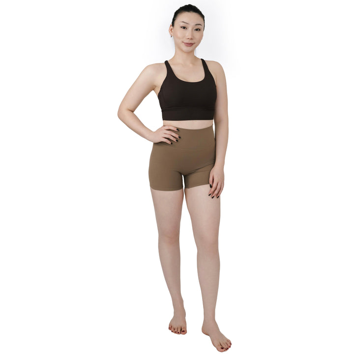 Full-body front view of VLIZ Ultra Soft SculptFit Short Leggings in Light Brown, highlighting high-waisted fit, body-contouring silhouette, and above-knee length.