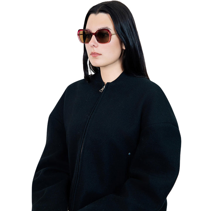 VLIZ Vista sunglasses with pink translucent square-edge frame and brown lenses, designed with a relaxed silhouette and engraved logo on temples
