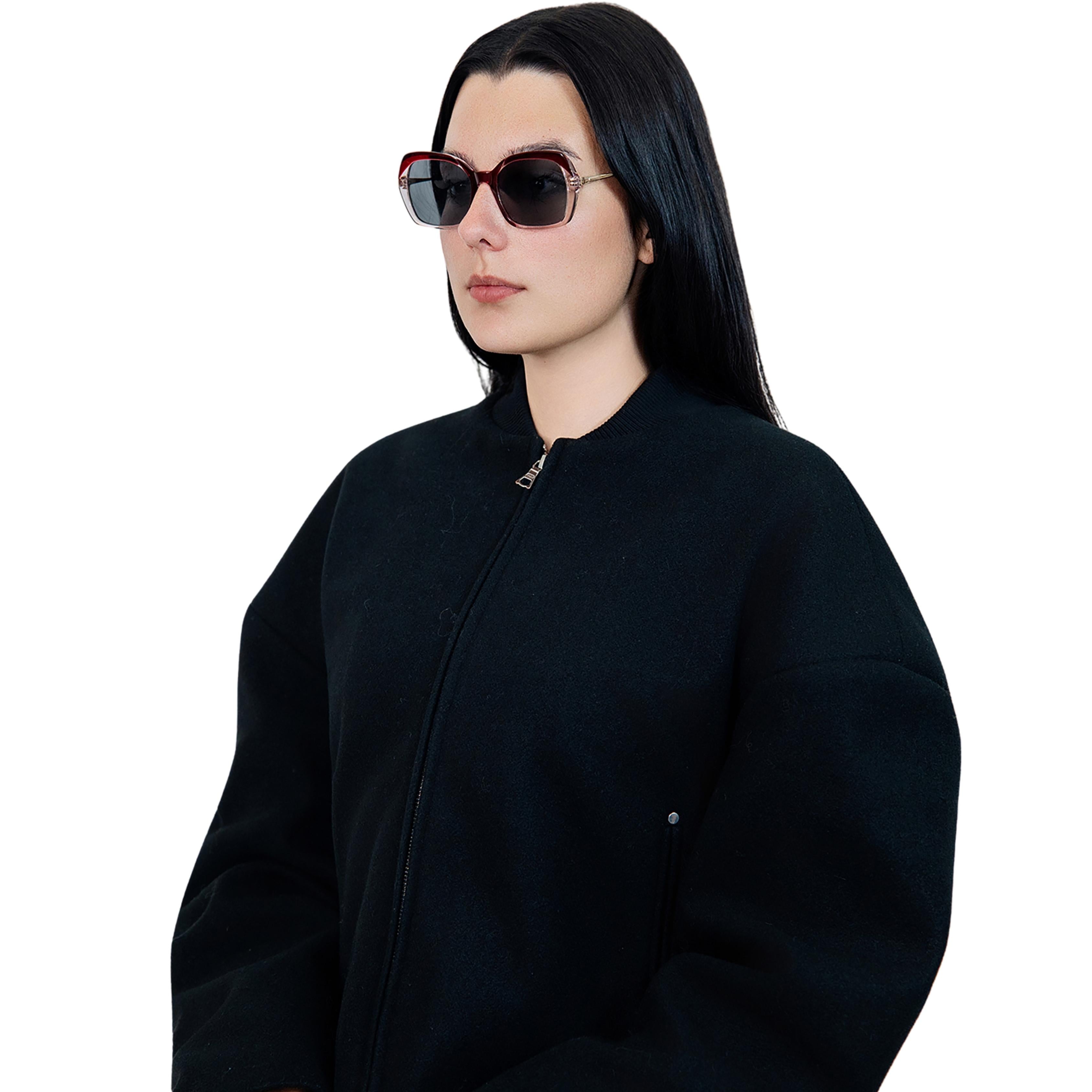 VLIZ Vista sunglasses with red translucent square-edge frame and black lenses, featuring softened angles, gradient styling, and engraved logo on temples.