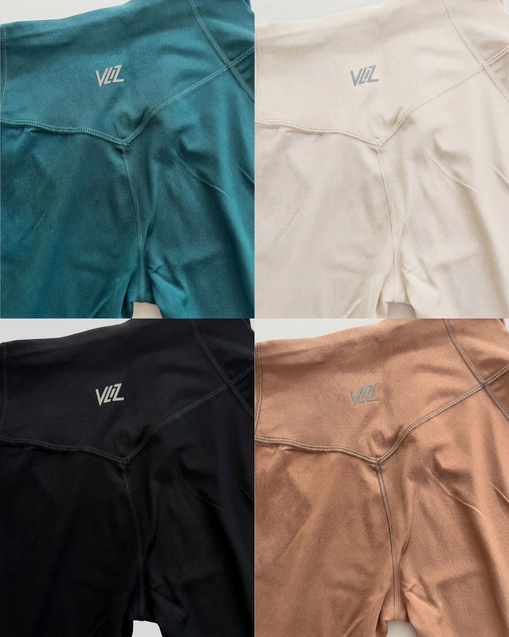 Four different colored athletic shirts with a brand logo on a white background