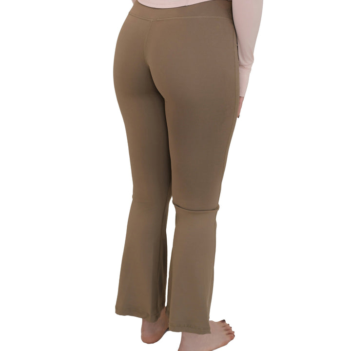 Back view of VLIZ High-Rise Sculpting Flare Leggings in light brown, showcasing the flare hem and smooth fit from waist to ankle.