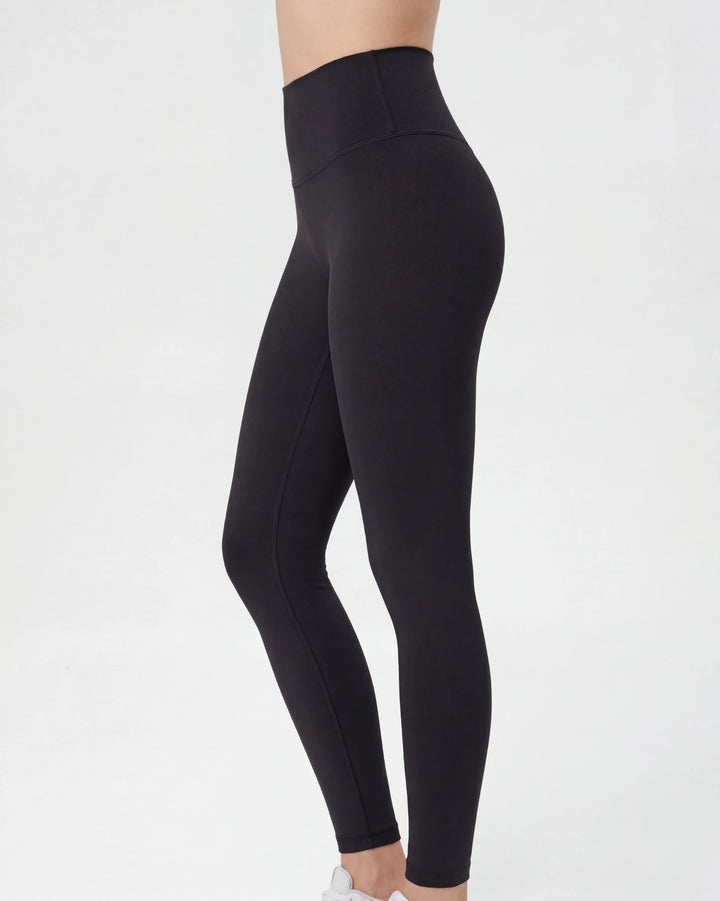 Black leggings worn by a person on a white background